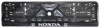 Рамка под номерной знак "HONDA" с серебристым рельефом и защелкой (арт. 33387)